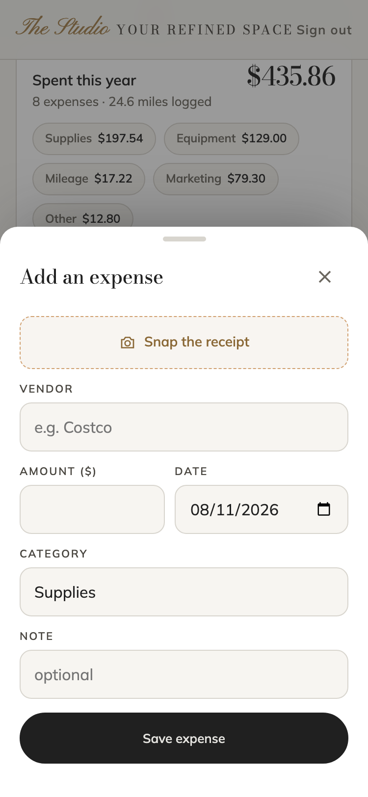 The Studio's add-an-expense sheet on a phone, with a snap-the-receipt camera button, vendor, amount, date, and category fields
